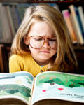 adorable-little-girl-with-glasses-getting-stressed-out